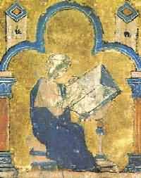 来自一部中世纪手稿的小画像，画了一个男人坐在桌边写书。