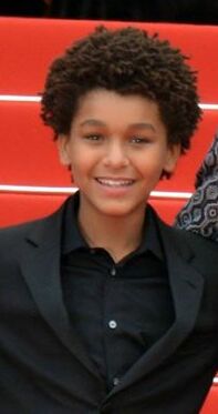 Jaden Michael wearing a black tuxedo on the red carpet of Cannes 2017 with the Wonderstruck crew