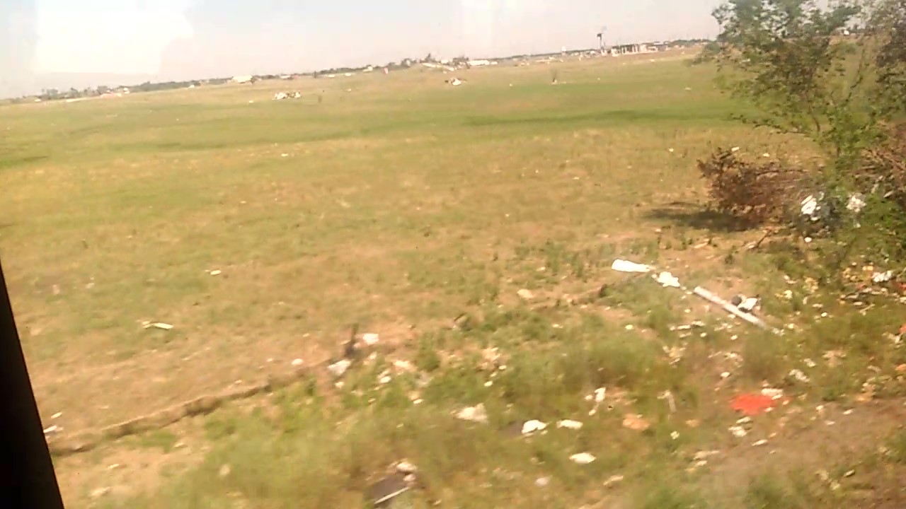 Debris strewn through fields south of Valley View exactly three weeks after the tornado struck.