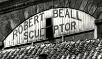 Painted sign, with the words: "Robert Beall Sculptor".