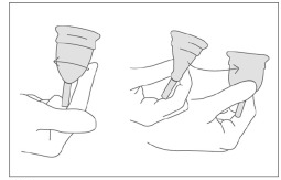 Running an index finger around the middle of the body of the cup; pinching the bottom and then twisting the cup.