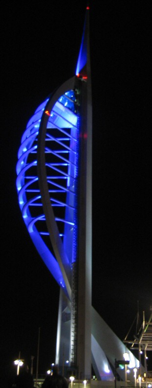 The Spinnaker Tower at night, showing the Tower's uplighting.