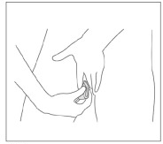 Spreading the labia with the fingers of one hand and inserting the folded cup rim-first into the vagina.