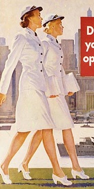 Two WAVES women in summer dress uniforms walking side by side down a city street