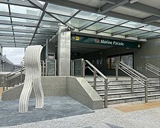 Entrance 3 of the station, with the artwork shaped like a white block of plasticine