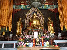 Temple with Buddha image, flanked by Ānanda and Mahākāśyapa