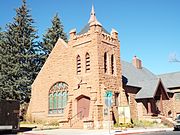 The Methodist Episcopal Church was built in 1906 and is located at 400 W. Aspen Ave. It was listed in the National Register of Historic Places in 1991.