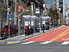 A bus stop in the median of an urban arterial