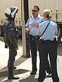 Motorcycle police officer alongside regular police in Australia, 2006