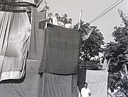 Hare Krishna Konar giving speech and Puchalapalli Sundarayya standing beside him in an AIKS meeting