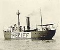 A boat on the water, with RELIEF painted on the side in large letters