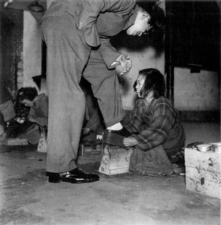 A Japanese war-orphaned girl shoeshining in Yūrakuchō, Tokyō in 1947