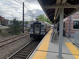A passenger train at a train station