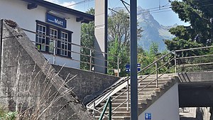 Steps up to platform with adjoining station building