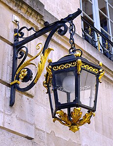 Carved and gilded lantern on the street facade