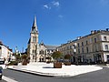 Place Victor-Hugo, the central and historic square of Cusset and the Saint-Saturnin Church