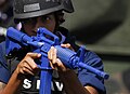 U.S. Navy sailor training with an M4 "Blue Gun"