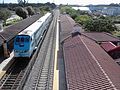 Tri-Rail Cab and Coach Bilevel cars being pushed by 2 GP49H-3s