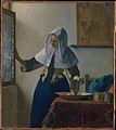 Woman with a Water Jug by Johannes Vermeer (c. 1662)