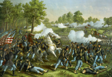 A painting depicting an American Civil War battle. In the foreground soldiers in blue surround a high-ranking officer on a white horse. The officer has been shot and is falling into the arms of one of the soldiers. They are fighting another group of soldiers who stand in the background wearing grey uniforms and firing weapons.