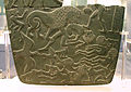 Image 3Possible prisoners and wounded men of the Buto-Maadi culture devoured by animals, while one is led by a man in long dress, probably an Egyptian official (fragment, top right corner). Battlefield Palette. (from Prehistoric Egypt)