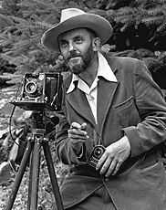 Ansel Adams and camera, photograph by J. Malcolm Greany