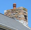 This modern house incorporates witches' stones in its chimneys