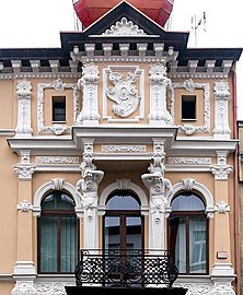 Balcony and initials within the cartouche