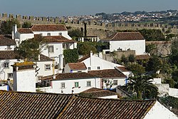 The medieval wall of the Castle of Óbidos dividing the town from the rest of the municipality