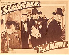 Tony holds a covered Tommy gun with other characters around him in a promotional card for the film stating "Scarface" with Paul Muni