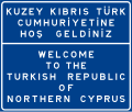 "Welcome to the Turkish Republic of Northern Cyprus" — TRNC sign, where it is placed at the "border" customs with the free piece