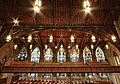 Wooden ceiling and the eastern wall of stained glass windows