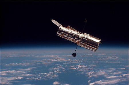 The Hubble Space Telescope as seen from the Space Shuttle Discovery on mission STS-82.
