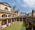 Image 4 Roman Baths Photograph credit: David Iliff The Roman Baths complex is a site of historical interest in the English city of Bath, Somerset. It is a well-preserved site dating from Roman Britain once used for public bathing. The Roman baths themselves are below the modern street level. There are four main features: the Sacred Spring, the Roman Temple, the Roman Bath House, and the museum which holds finds from the Roman town. The buildings above street level date from the 19th century. The Baths are a major tourist attraction and, together with the Grand Pump Room, received more than 1.3 million visitors in 2018. Visitors can tour the baths and museum but cannot enter the water. This picture shows the Great Bath of the Roman Baths complex, with Bath Abbey visible in the background. The entire structure above the level of the pillar bases is of later construction. More featured pictures