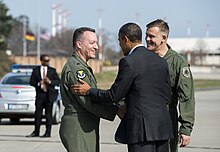 Obama arrives in Ramstein to meet with wounded soldiers and confer with military generals.