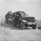 A tank transporter tows a trailer with a Churchill tank for the crossing of the Rhine.