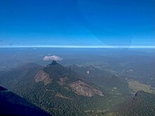 Small cloud over the 'cloud catcher' on a clear day.