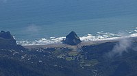 Aerial view of Piha Beach and Lion Rock