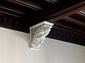 Corbel on grand staircase which may represent Barber