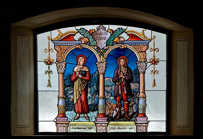 圖為題為《致已婚夫婦圖》的花窗玻璃，位於奧地利納瑟爾文勒的聖母升天教區聖堂。圖上的兩位聖人是一對婚姻已婚夫婦，農人聖伊西多祿及瑪利亞·托里比亞。今天是他們的瞻禮日。