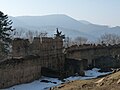 The western walls of the Lower Castle in early March, the Stebnická Magura range in the distance (March 2012)