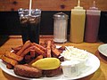 Crab cakes, sweet potato french fries, cole slaw, tartar sauce, Coca-Cola and a wedge of lemon served at Bartley's in Harvard Square