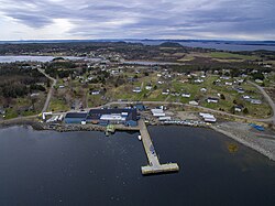 Aerial view featuring the fish plant, the major employer of the community.