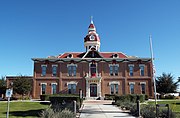 The Second Pinal County Courthouse was built in 1891 and is located in 135 Pinal St. The Courthouse is the most important architectural landmark in Florence and the most outstanding surviving example of the American-Victorian Style in Central Arizona. The building was designed by Arizona architect James M. Creighton, who was among the Territory’s first architects. Three notorious women were presented before this court. They were Pearl Heart, Eva Dugan and Winnie Ruth Judd. Listed in the National Register of Historic Places in August 2, 1978, reference #78000568.