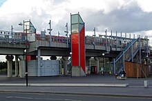 Elevated DLR station, with lift shafts clad in red