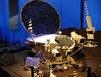 Model of Lunokhod 2. The retroreflector is the hexagonal box with open lid in the front.