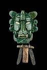 Mosaic mask that represents a Bat god, 25 pieces of jade, with yellow eyes made of shell. It was found in a tomb at Monte Albán