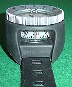 Diving wrist compass showing window for reading bearing and course