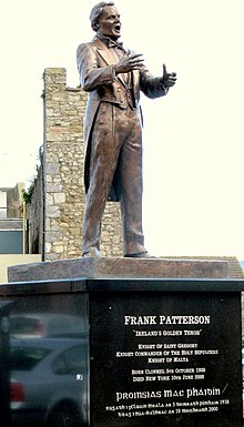 Bronze life-size piece by Jerry McKenna titled "The Golden Tenor Statue". Unveiled in Mick Delahunty Square Clonmel, June 2002.