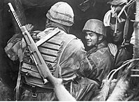 German and Italian paratroopers at the Anzio-Nettuno front; the Italian has a MAB 38A slung across his back.